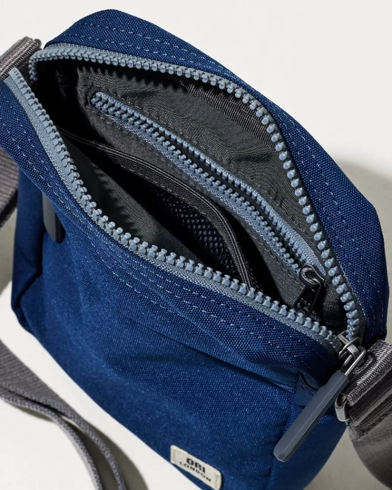 Bandolera Tommy Bahama Bond en Lona - Estilo Cruzado Versátil para Aventuras Diarias