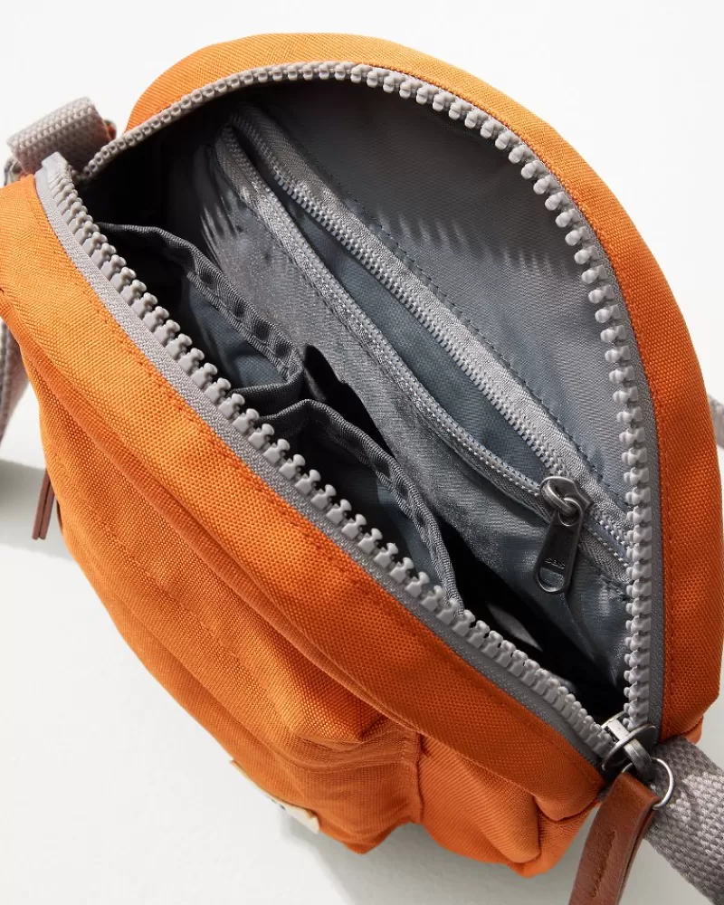 Bandolera Cruzada Paddington de Tommy Bahama - Bolso Ligero con Estilo Resort para Viajes y Uso Diario